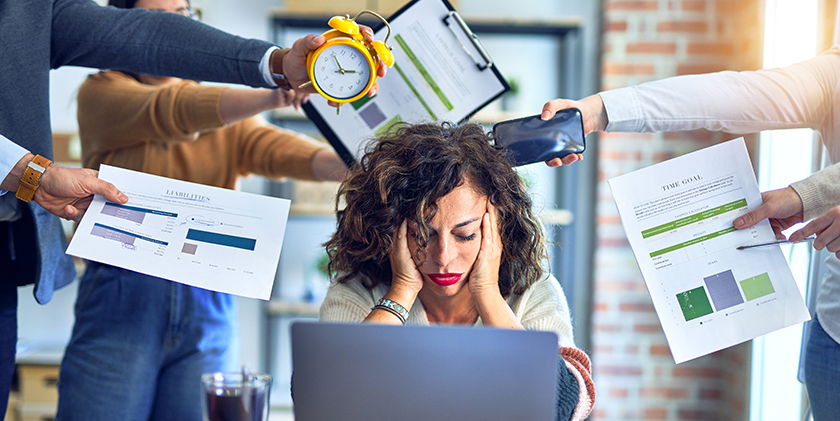 Group of business workers working together. Partners stressing one of them at the office Group of business workers working together. Partners stressing one of them at the office